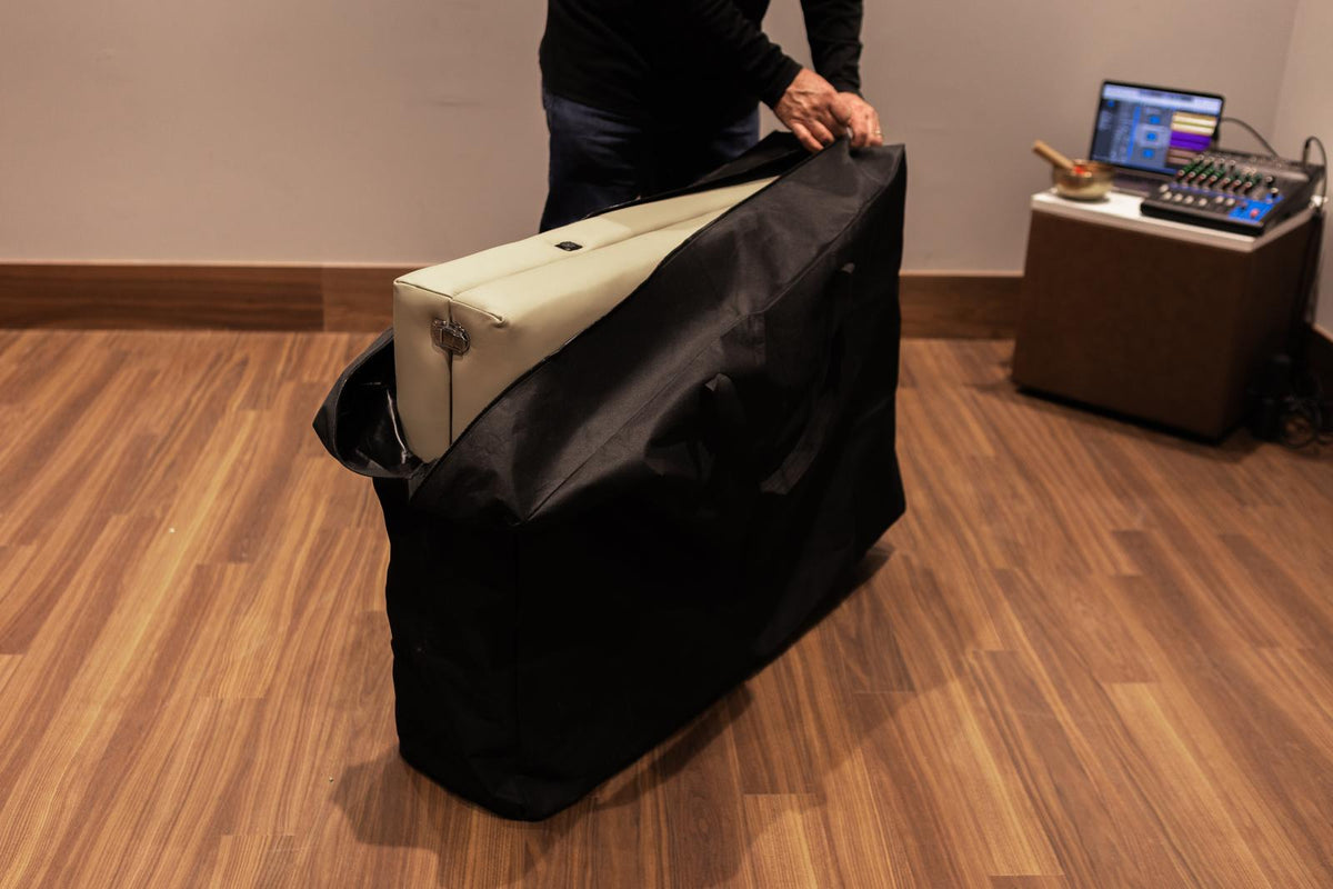Folded Onizion sound bed being packed into its black carry case